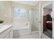 Bathroom with soaking tub and separate shower at 3260 Marshfield Preserve Way, Kissimmee, FL 34746
