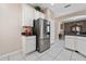 Stainless steel appliances and white cabinetry highlight this kitchen at 3260 Marshfield Preserve Way, Kissimmee, FL 34746