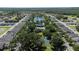 Aerial view of community with pond, pool, and tennis court at 3260 Marshfield Preserve Way, Kissimmee, FL 34746