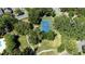 Community tennis court surrounded by lush trees at 3260 Marshfield Preserve Way, Kissimmee, FL 34746