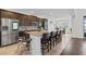 Kitchen island with granite countertops and seating for four at 3273 Wauseon Dr, St Cloud, FL 34772