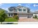Two-story house with solar panels and brick driveway at 3273 Wauseon Dr, St Cloud, FL 34772