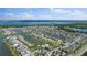 Aerial view of a lakefront community with a pool at 3273 Wauseon Dr, St Cloud, FL 34772