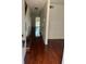 Long entryway with hardwood floors and staircase leading upstairs at 2351 Huntington Green Ct # 8, Orlando, FL 32839