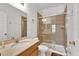 Bathroom with walk-in shower and wood vanity at 2732 Oakwater Dr # 101, Kissimmee, FL 34747