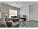 Cozy living room featuring comfortable seating and a large TV at 2732 Oakwater Dr # 101, Kissimmee, FL 34747