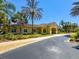Community center with palm trees and landscaping at 2732 Oakwater Dr # 101, Kissimmee, FL 34747