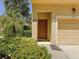 Inviting front door entrance of the townhome with landscaping at 2732 Oakwater Dr # 101, Kissimmee, FL 34747