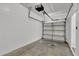 Empty garage with an overhead door and white block walls at 2732 Oakwater Dr # 101, Kissimmee, FL 34747
