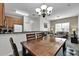 Open concept dining area with adjacent kitchen and living room at 2732 Oakwater Dr # 101, Kissimmee, FL 34747