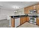 Modern kitchen featuring ample cabinet space and a breakfast bar at 2732 Oakwater Dr # 101, Kissimmee, FL 34747