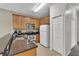 Well-equipped kitchen with granite countertops and stainless steel appliances at 2732 Oakwater Dr # 101, Kissimmee, FL 34747