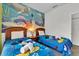 bedroom with a fun ocean mural and twin beds at 2732 Oakwater Dr # 101, Kissimmee, FL 34747
