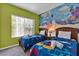 bedroom with twin beds and ocean mural at 2732 Oakwater Dr # 101, Kissimmee, FL 34747