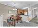 Dining area with a wooden table, bench, and chandelier at 2732 Oakwater Dr # 101, Kissimmee, FL 34747