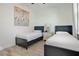 Bedroom with twin beds, nightstand, and art at 3136 Caribbean Soul Dr, Kissimmee, FL 34747