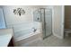 Bathroom featuring a large garden tub and a separate shower stall at 7953 Sea Pearl Cir, Kissimmee, FL 34747