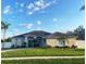 House exterior showcasing a two-story home with a landscaped yard at 7953 Sea Pearl Cir, Kissimmee, FL 34747