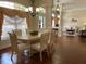 Elegant dining room with a large table, six chairs, and hardwood floors at 7953 Sea Pearl Cir, Kissimmee, FL 34747