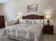 Main bedroom with king-size bed, nightstands, and wood dresser at 7953 Sea Pearl Cir, Kissimmee, FL 34747