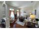 Living room featuring hardwood floors, sofas and a neutral color scheme at 7953 Sea Pearl Cir, Kissimmee, FL 34747