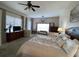 Spacious main bedroom with king bed, sitting area, and large windows at 7953 Sea Pearl Cir, Kissimmee, FL 34747