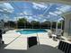 Relaxing screened pool and patio with ample seating at 7953 Sea Pearl Cir, Kissimmee, FL 34747