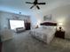 Large main bedroom with king-size bed and sitting area at 7953 Sea Pearl Cir, Kissimmee, FL 34747