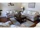Bright living room with two sofas, coffee table, and decorative accents at 7953 Sea Pearl Cir, Kissimmee, FL 34747