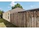 Well-maintained house with wooden fence and covered patio at 2726 Randal Way, Kissimmee, FL 34743