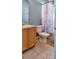Bathroom with shower/tub combo and wood cabinets at 2726 Randal Way, Kissimmee, FL 34743
