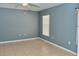 Simple bedroom with tile floors and neutral walls at 2726 Randal Way, Kissimmee, FL 34743