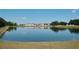 Peaceful lake view reflecting homes and lush greenery at 2726 Randal Way, Kissimmee, FL 34743