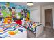 ' bedroom with twin beds and Mickey Mouse wall at 4577 Target Blvd, Kissimmee, FL 34746