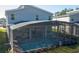 Relaxing screened-in pool area with lounge chairs and patio furniture at 4577 Target Blvd, Kissimmee, FL 34746