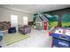 Playful game room featuring a playhouse, air hockey, and LEGO wall at 4577 Target Blvd, Kissimmee, FL 34746