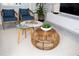 Living room with a round bamboo coffee table and two side tables at 4577 Target Blvd, Kissimmee, FL 34746