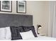 Bedroom with gray headboard and black and white patterned pillows at 4577 Target Blvd, Kissimmee, FL 34746