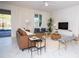 Relaxing living room with leather couch, two armchairs and access to the backyard pool at 4577 Target Blvd, Kissimmee, FL 34746