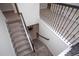 Modern staircase with metal railing and carpet runner at 4577 Target Blvd, Kissimmee, FL 34746