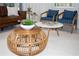 Stylish living room with a round bamboo coffee table and two side tables at 4577 Target Blvd, Kissimmee, FL 34746