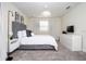 Bright bedroom with gray headboard and white bedding at 4577 Target Blvd, Kissimmee, FL 34746