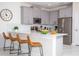 Modern kitchen with stainless steel appliances and breakfast bar at 4577 Target Blvd, Kissimmee, FL 34746