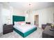 Main bedroom with plush green velvet headboard and modern lighting at 4577 Target Blvd, Kissimmee, FL 34746
