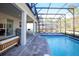 Screened pool area with lounge chairs and outdoor seating at 4577 Target Blvd, Kissimmee, FL 34746