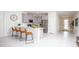 Modern kitchen with gray cabinets, white countertops, and breakfast bar at 4577 Target Blvd, Kissimmee, FL 34746