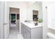 Modern bathroom with double vanity and gray cabinets at 4577 Target Blvd, Kissimmee, FL 34746