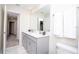 Modern bathroom with double vanity and marble-tiled floors at 4577 Target Blvd, Kissimmee, FL 34746