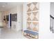 Bright entryway with modern wall art and a bench at 4577 Target Blvd, Kissimmee, FL 34746