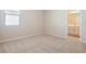 Bedroom with carpet and en-suite bathroom access at 2204 Mac Blvd, Eagle Lake, FL 33839